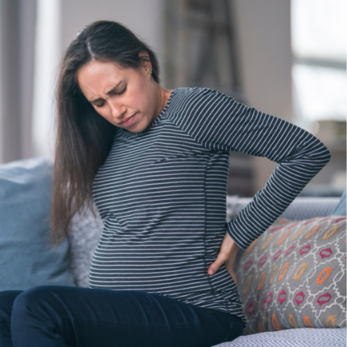 Pregnant Woman Holding Her Sore Back
