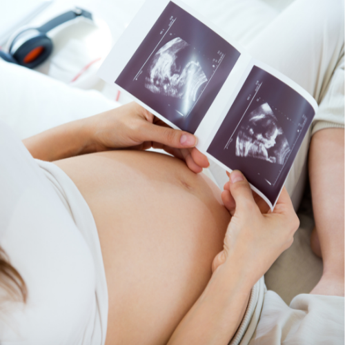 Pregnant Mother Holding Pregnancy Ultrasound