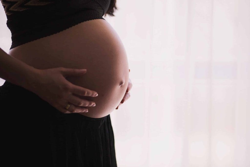 Pregnant Woman Holding Her Stomach