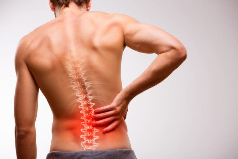 Man experiencing back pain and discomfort